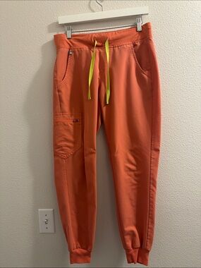 Women’s FIGs Coral Pink Jogger Pants with Neon Yellow Drawstring
